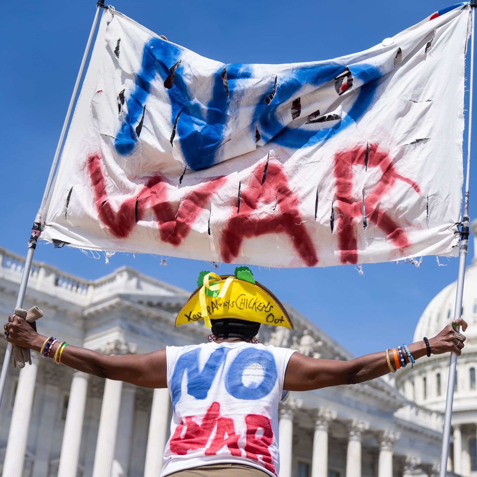 Should Democrats Be The Anti-War Party? - What A Day cover
